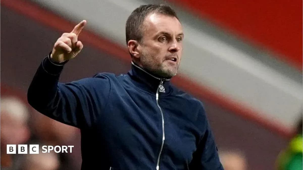 Coach gesturing during a match on the sidelines
