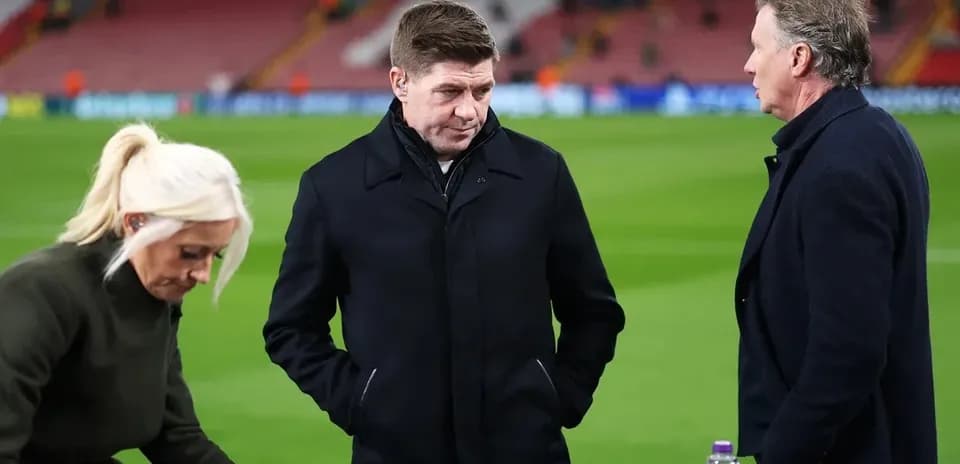 Three analysts discussing on the pitch after match