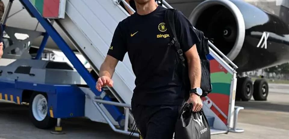 Coach walking from airplane at airport terminal