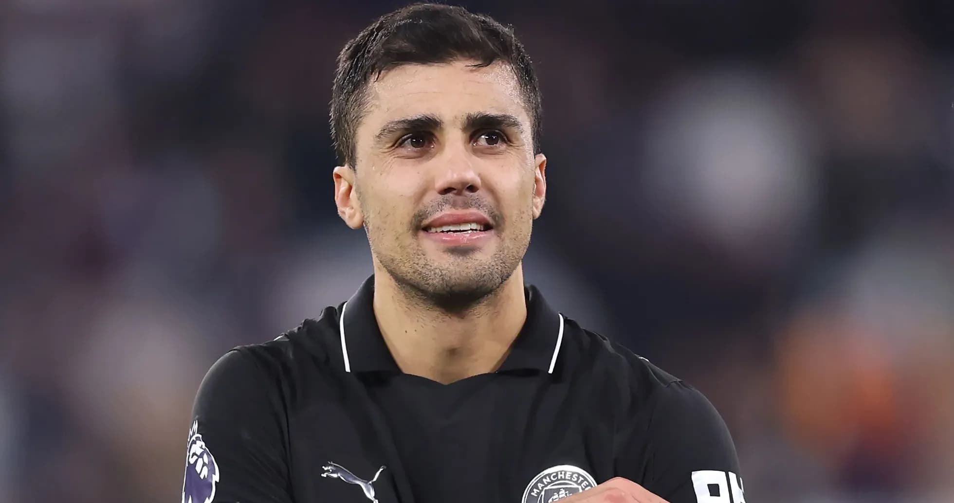 Player in black jersey celebrating on the field