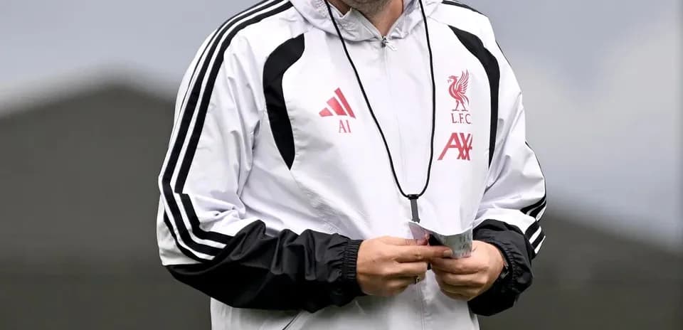 Coach smiling during training session at Liverpool FC