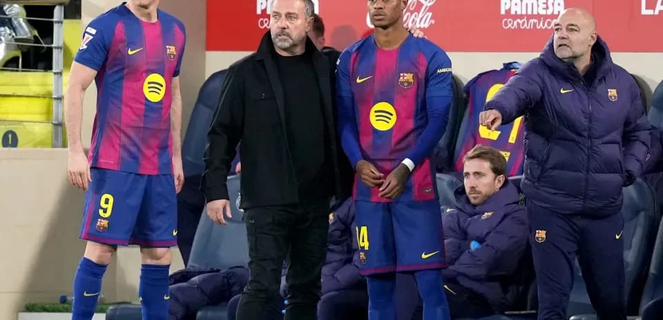 Barcelona players and coaches on the sideline