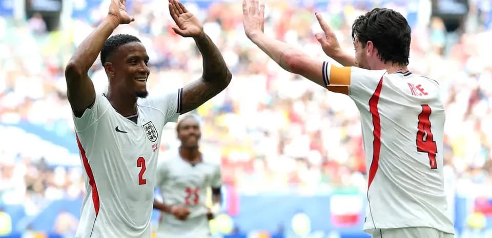 Two players celebrating a goal during a match