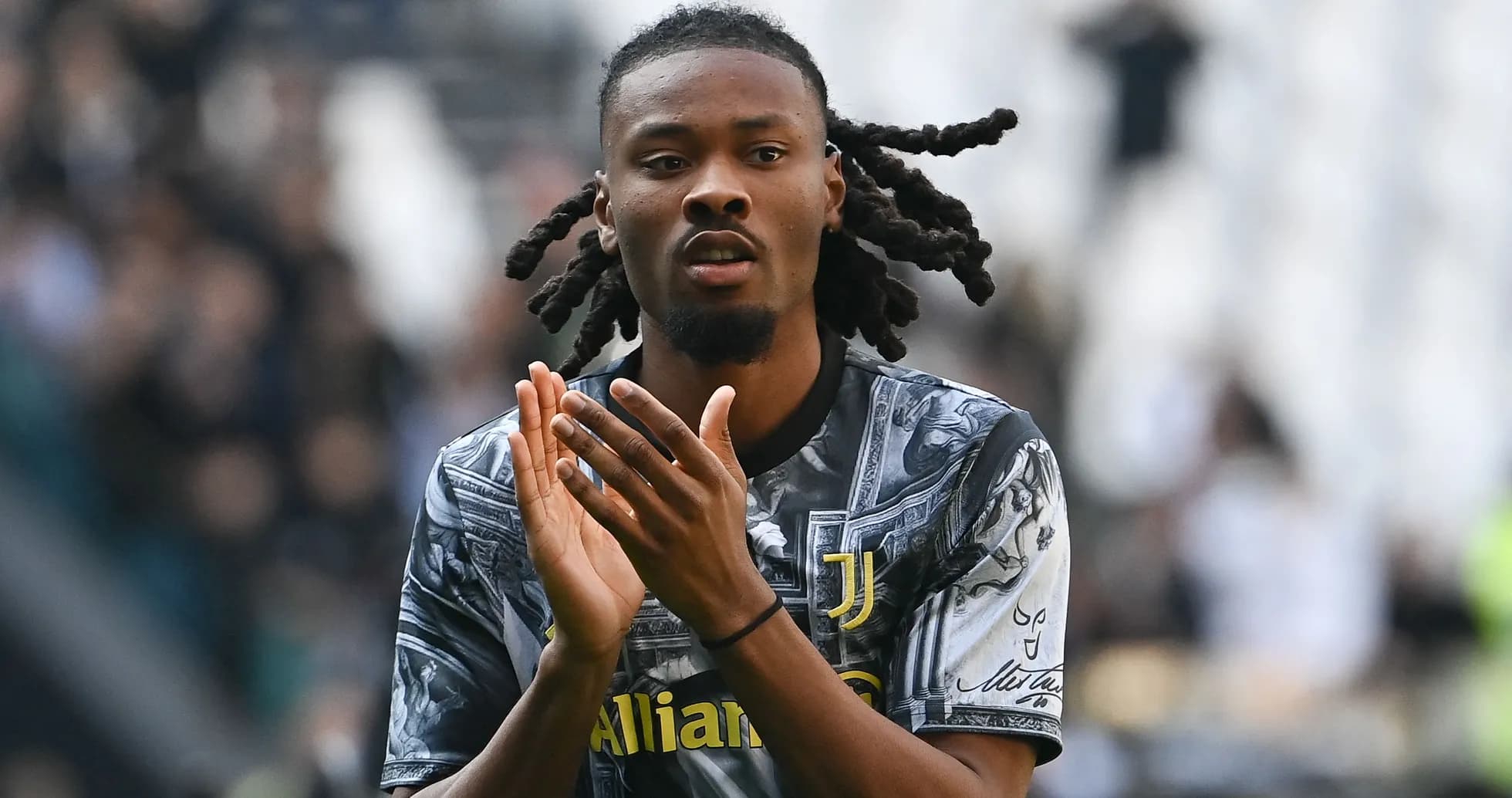 Player applauding fans in Juventus jersey