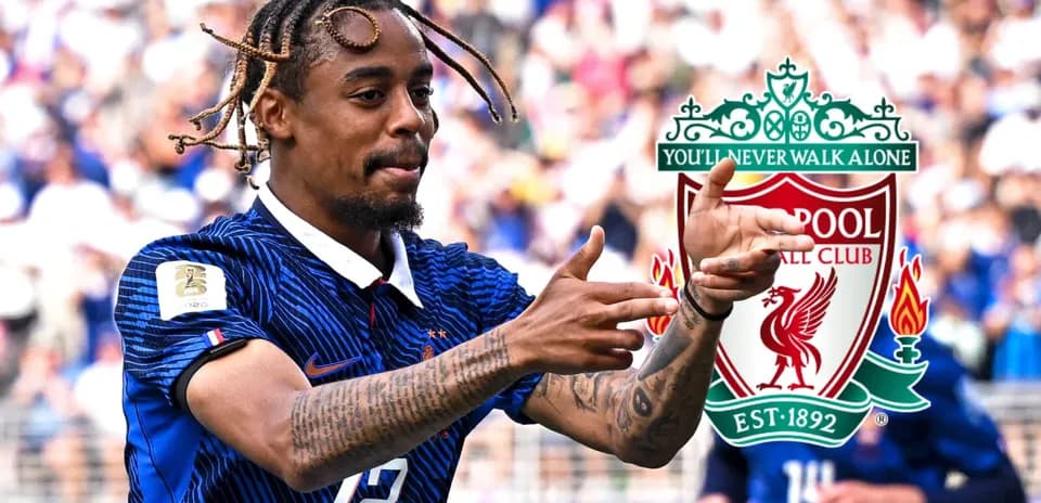 Player celebrating during match with Liverpool logo