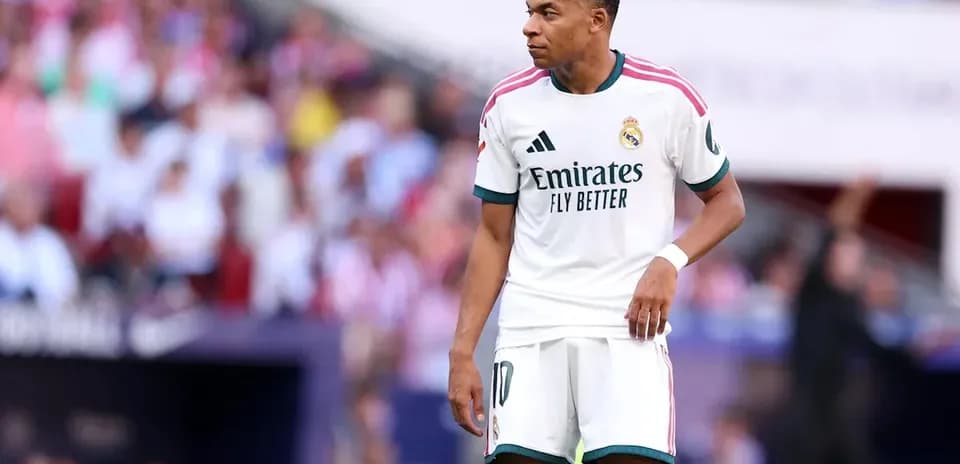 Kylian Mbappé in Real Madrid kit on the field