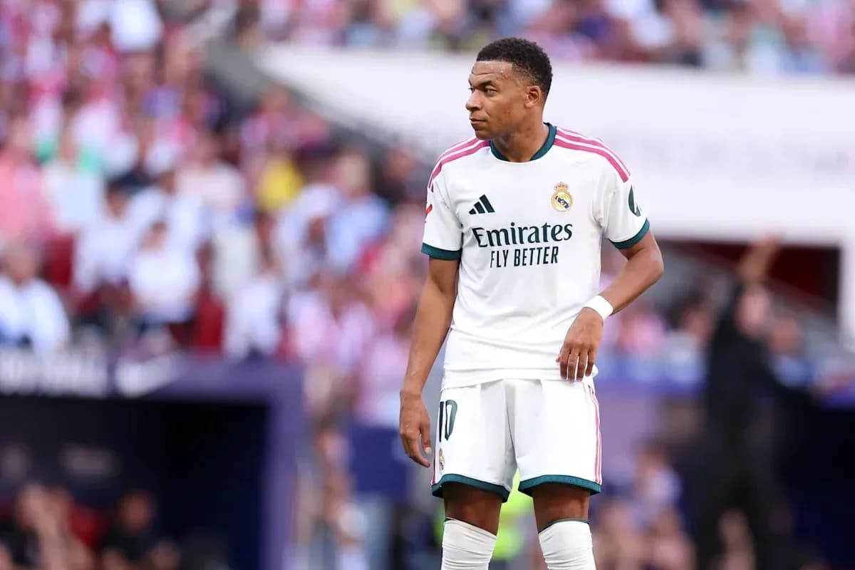 Kylian Mbappé in Real Madrid kit on the field