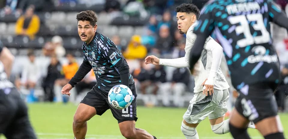 Player dribbling the ball during Velocity match