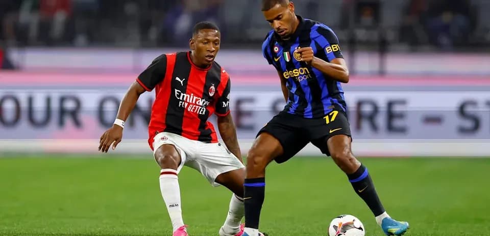 Two players contesting possession of the ball