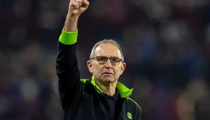 Manager celebrating with raised fist after match