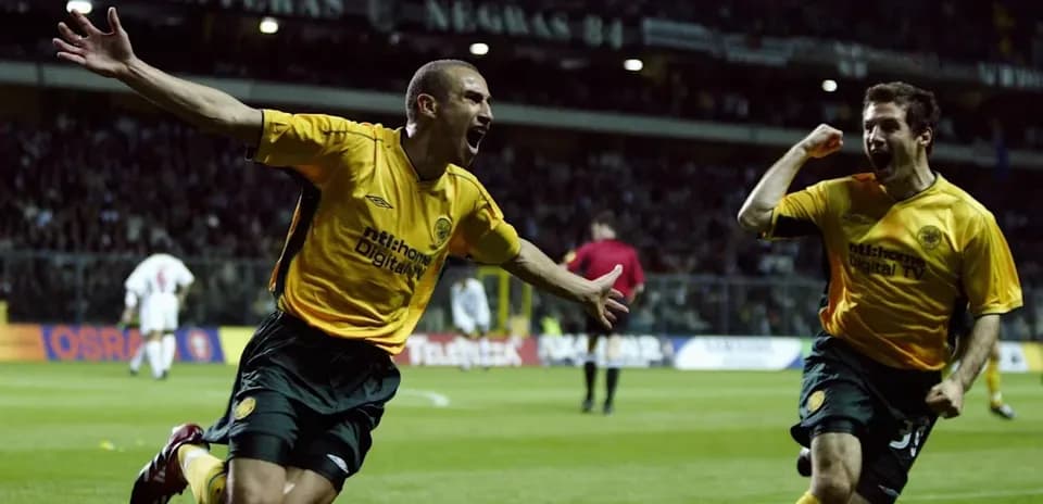 Two players celebrating a goal during a match