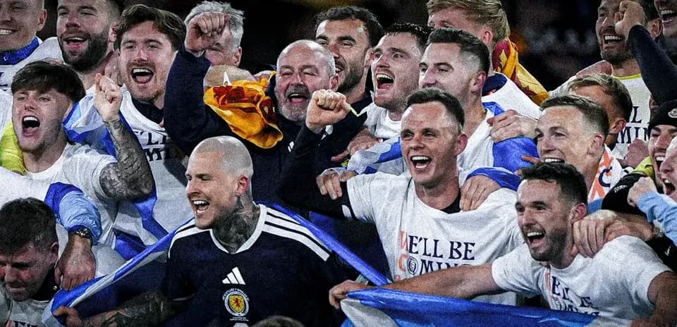 Team celebrating with shirts after a victory