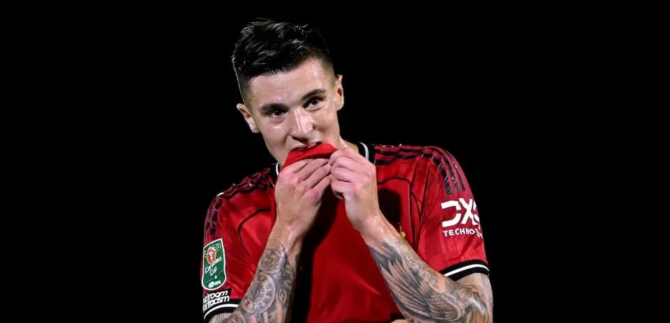 Player in red jersey biting his shirt
