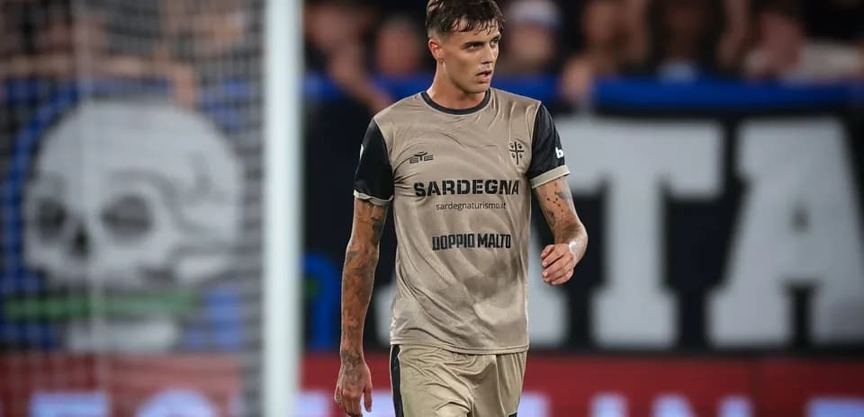 Player walking on field wearing team uniform