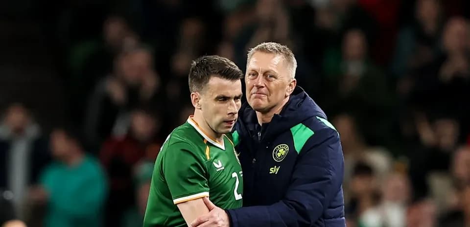 Player receiving support from coach after match
