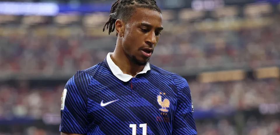 Player in France kit during match action