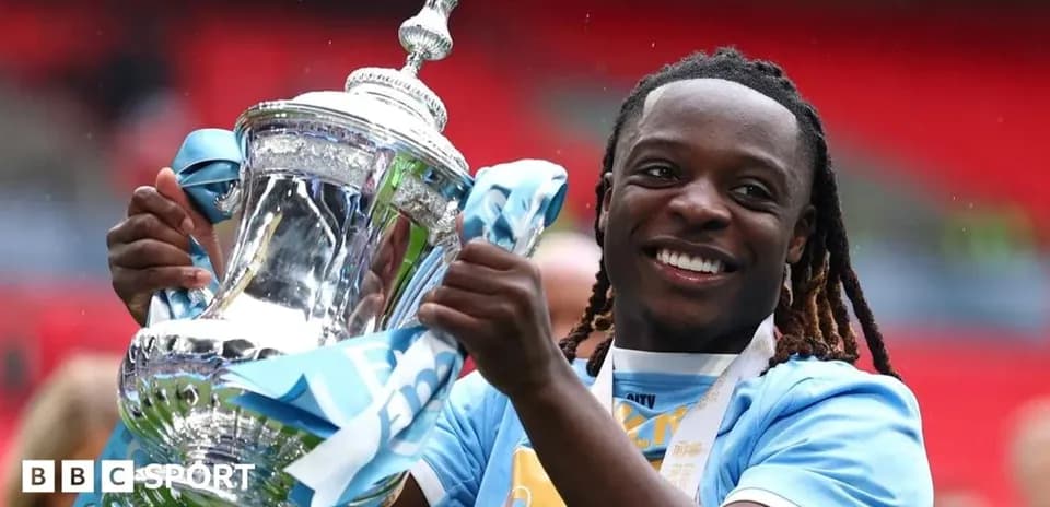 Player celebrating with trophy after match victory