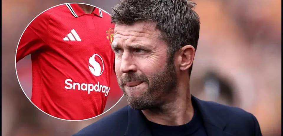 Coach with Manchester United jersey in background