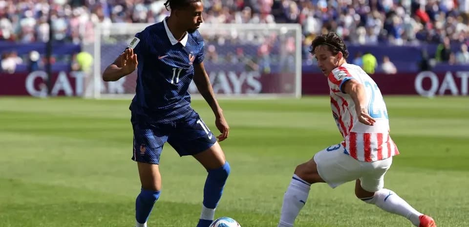 Player tackling during Paraguay vs France match