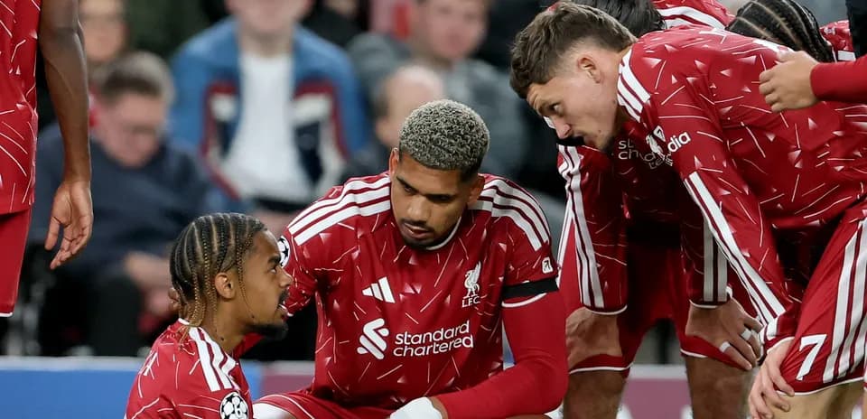 Liverpool players discussing strategy during match break