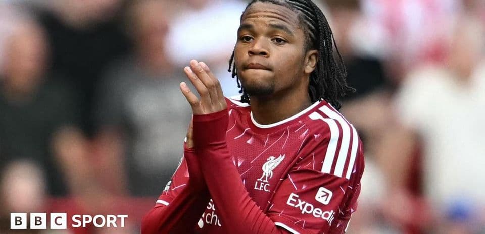 Player in Liverpool kit during match warm-up