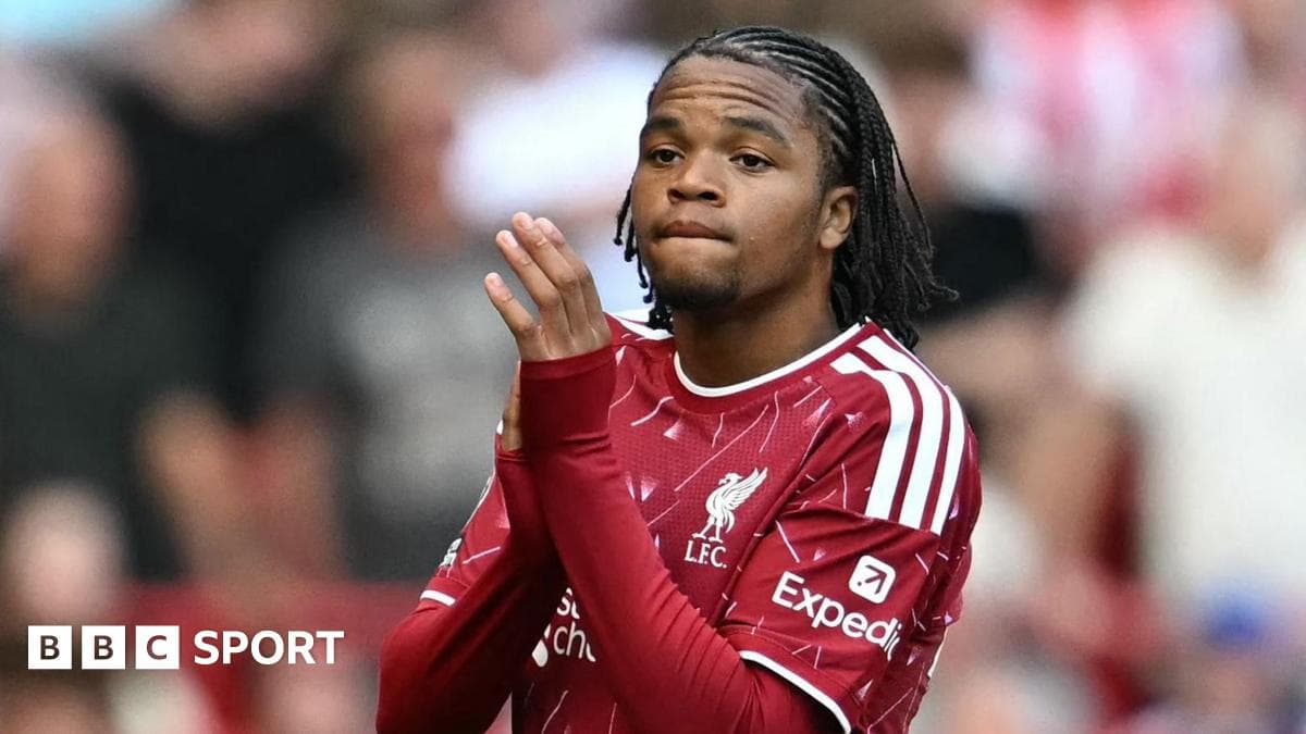 Player in Liverpool kit during match warm-up