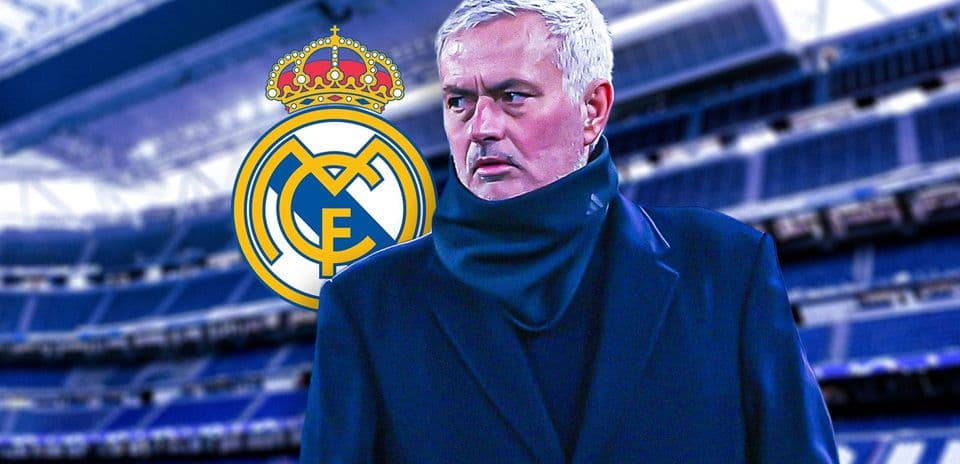 Coach standing in front of Real Madrid logo