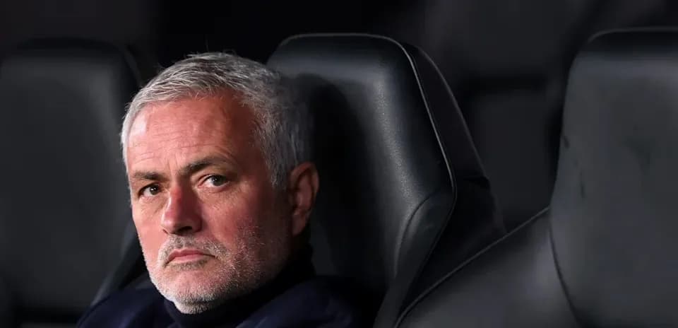 Coach sitting on the bench during a match