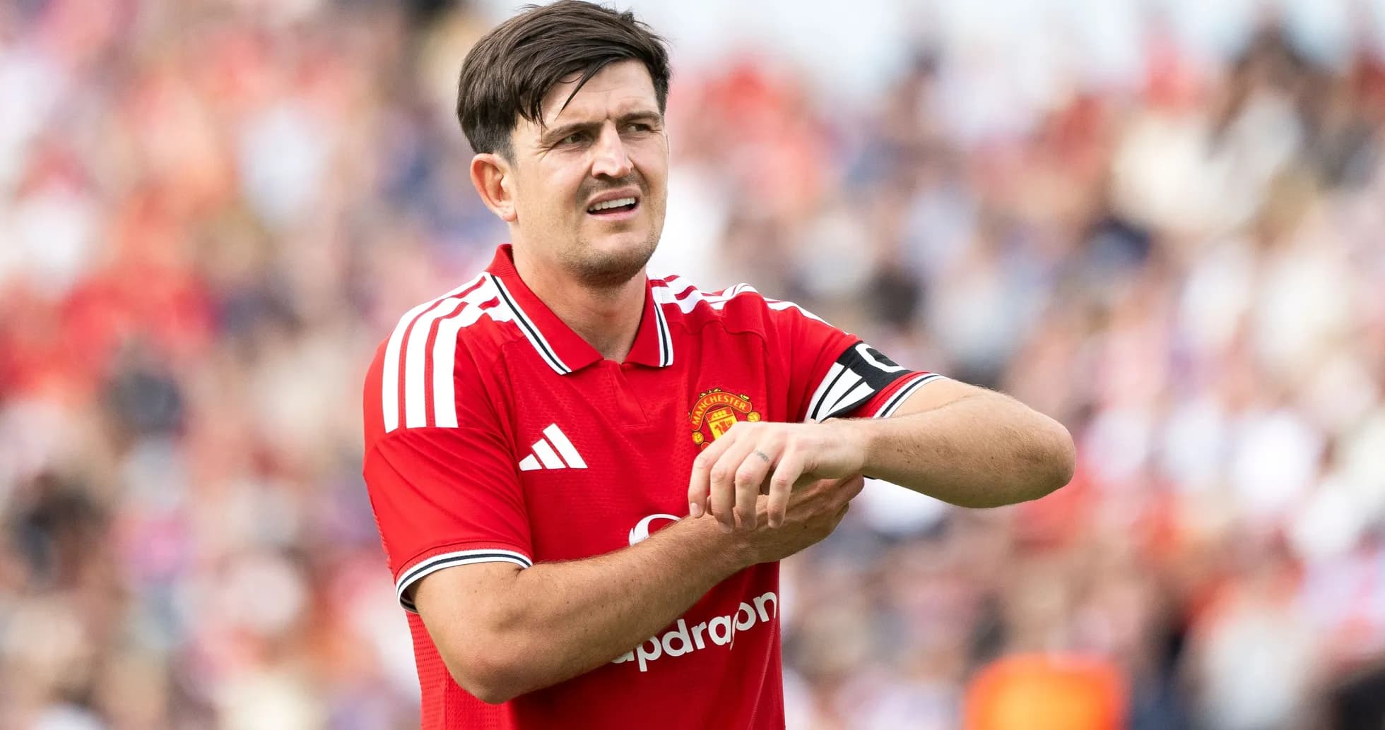 Player adjusting wrist during match for Manchester United