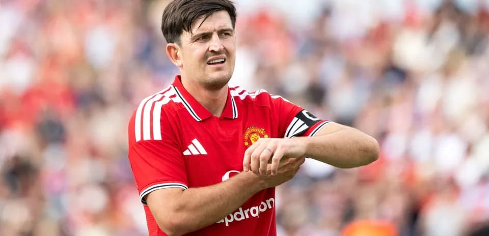 Player adjusting wrist during match for Manchester United