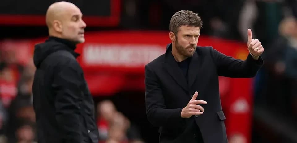 Two managers on sidelines during football match