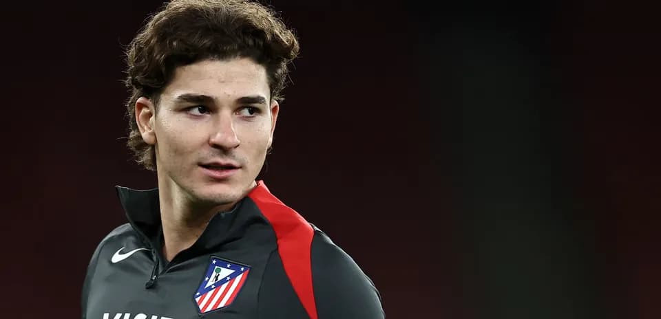 Player in Atlético Madrid training gear looking off
