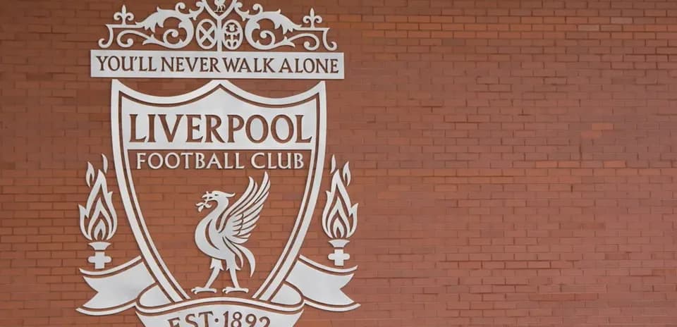 Liverpool Football Club crest on brick wall
