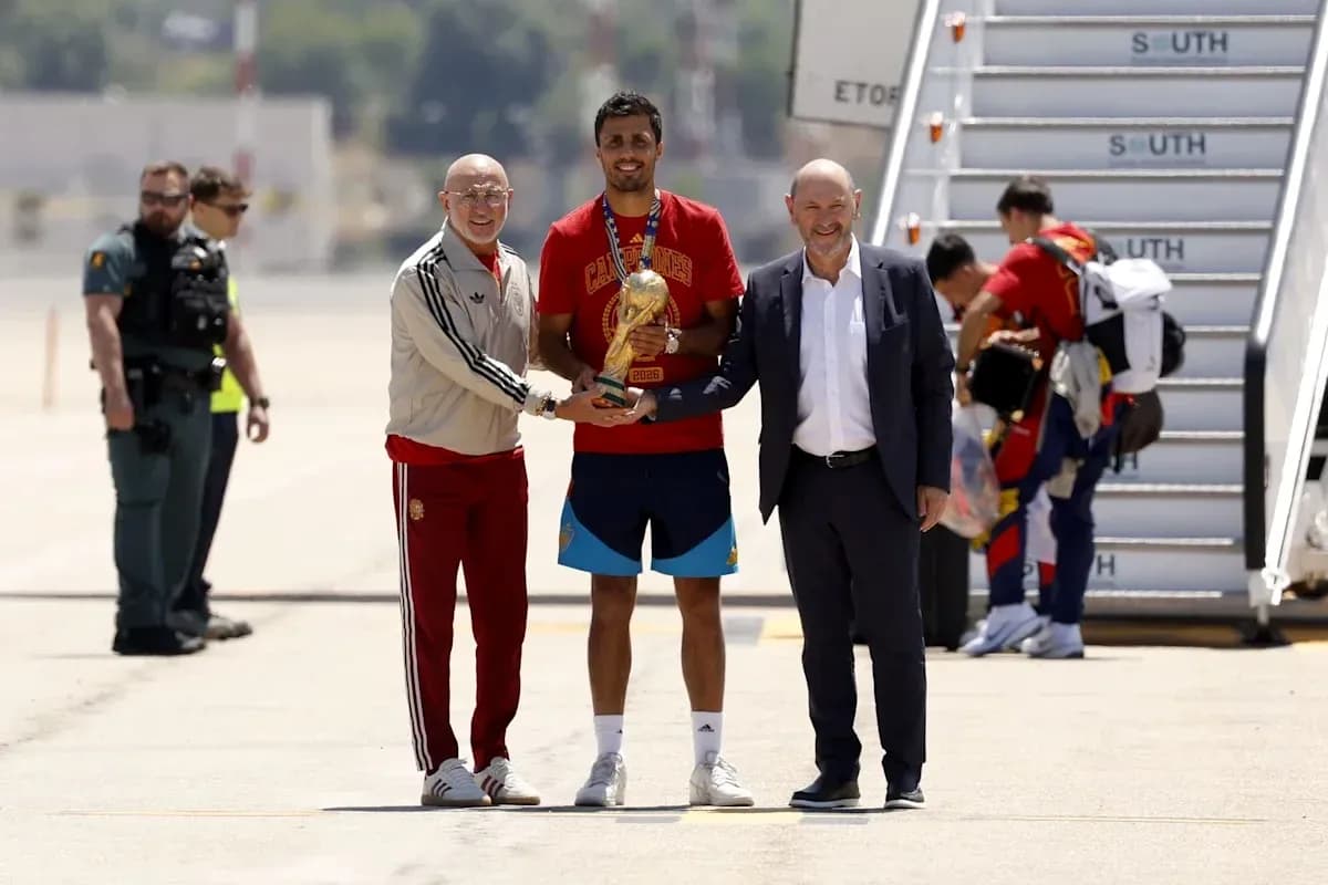 Player receiving trophy with officials at airport