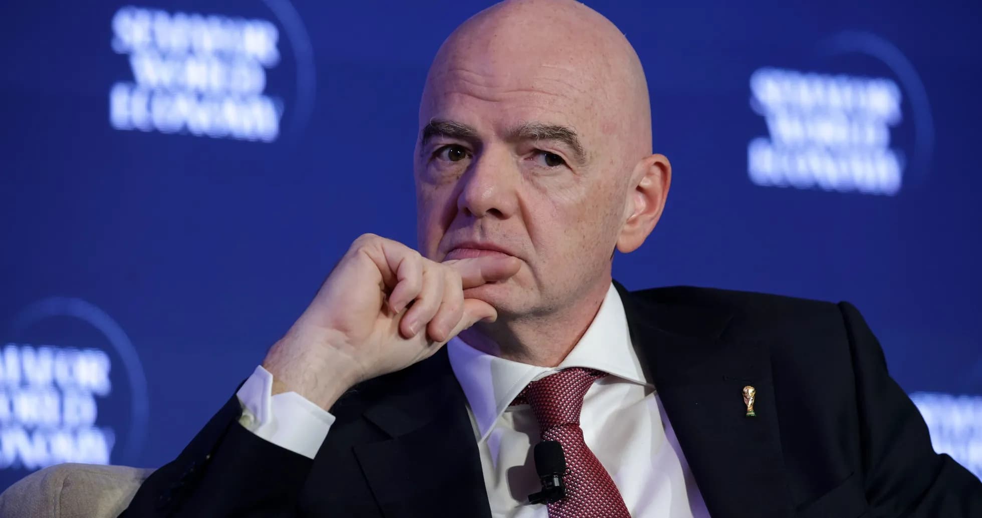 Man with a thoughtful expression at a conference