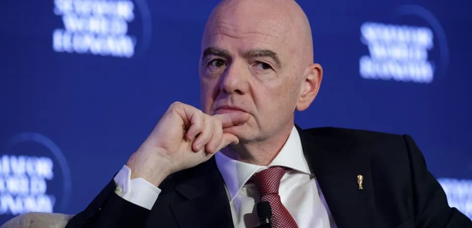Man with a thoughtful expression at a conference