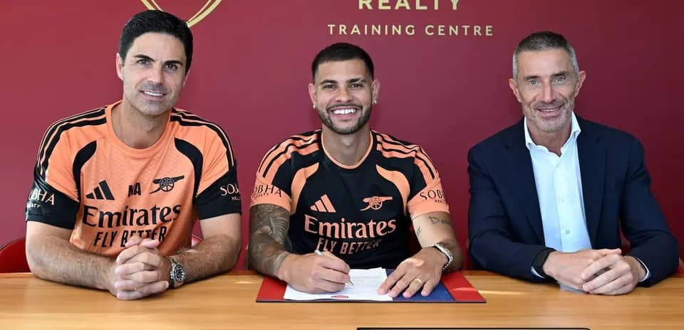 Player signing contract with club officials at training center