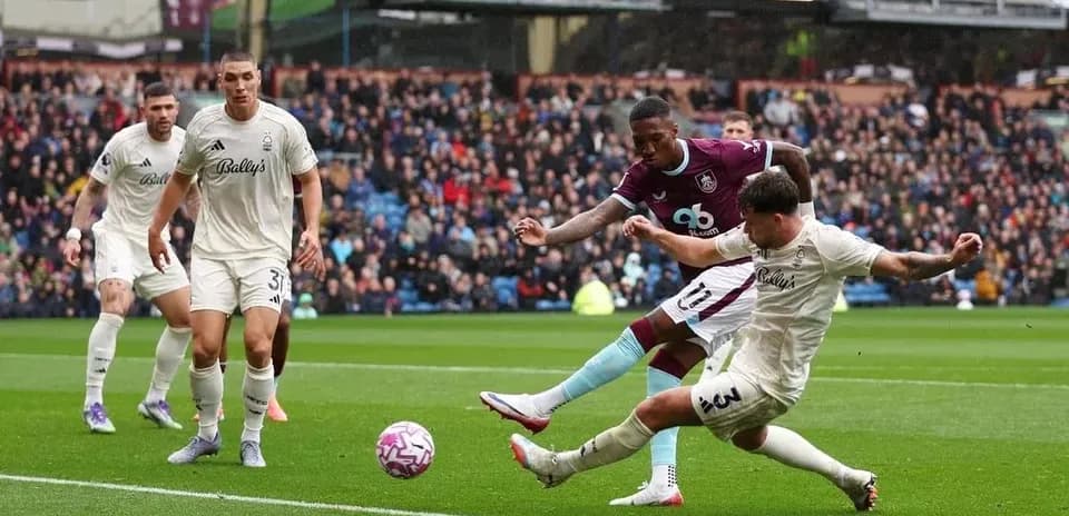Players competing for the ball in match action