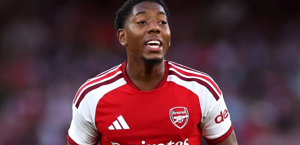 Player celebrating in Arsenal's red jersey