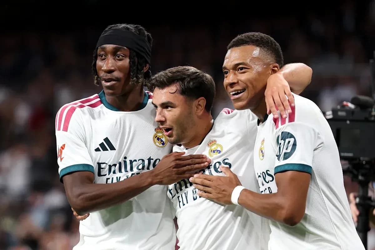 Three Real Madrid players celebrating a goal together