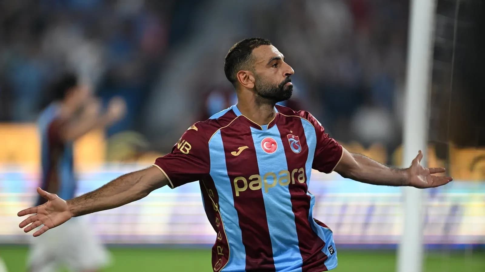 Player celebrating goal during match in stadium