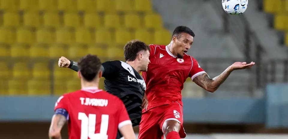 CSKA Sofia player challenging OFI player for the ball