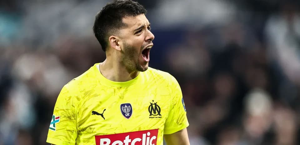 Goalkeeper shouting during a match in yellow kit