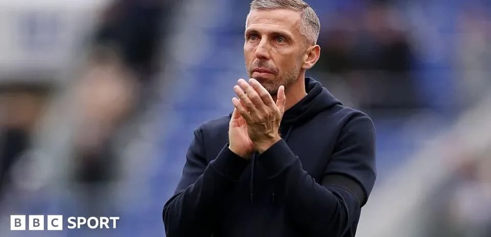 Coach applauding fans after a match