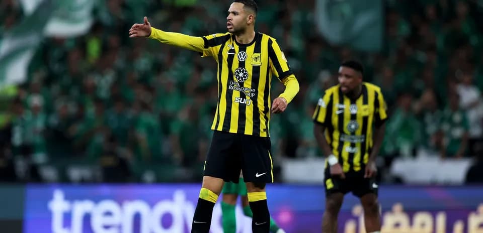Player directing teammates during a football match