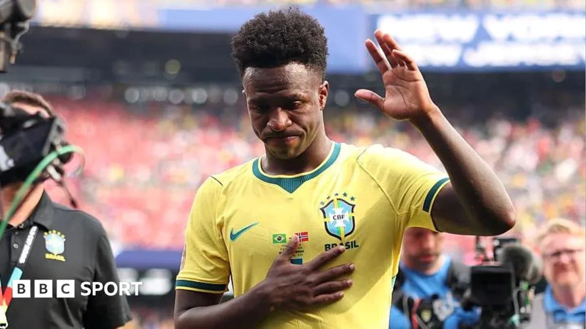 Player in Brazil jersey waving to the crowd
