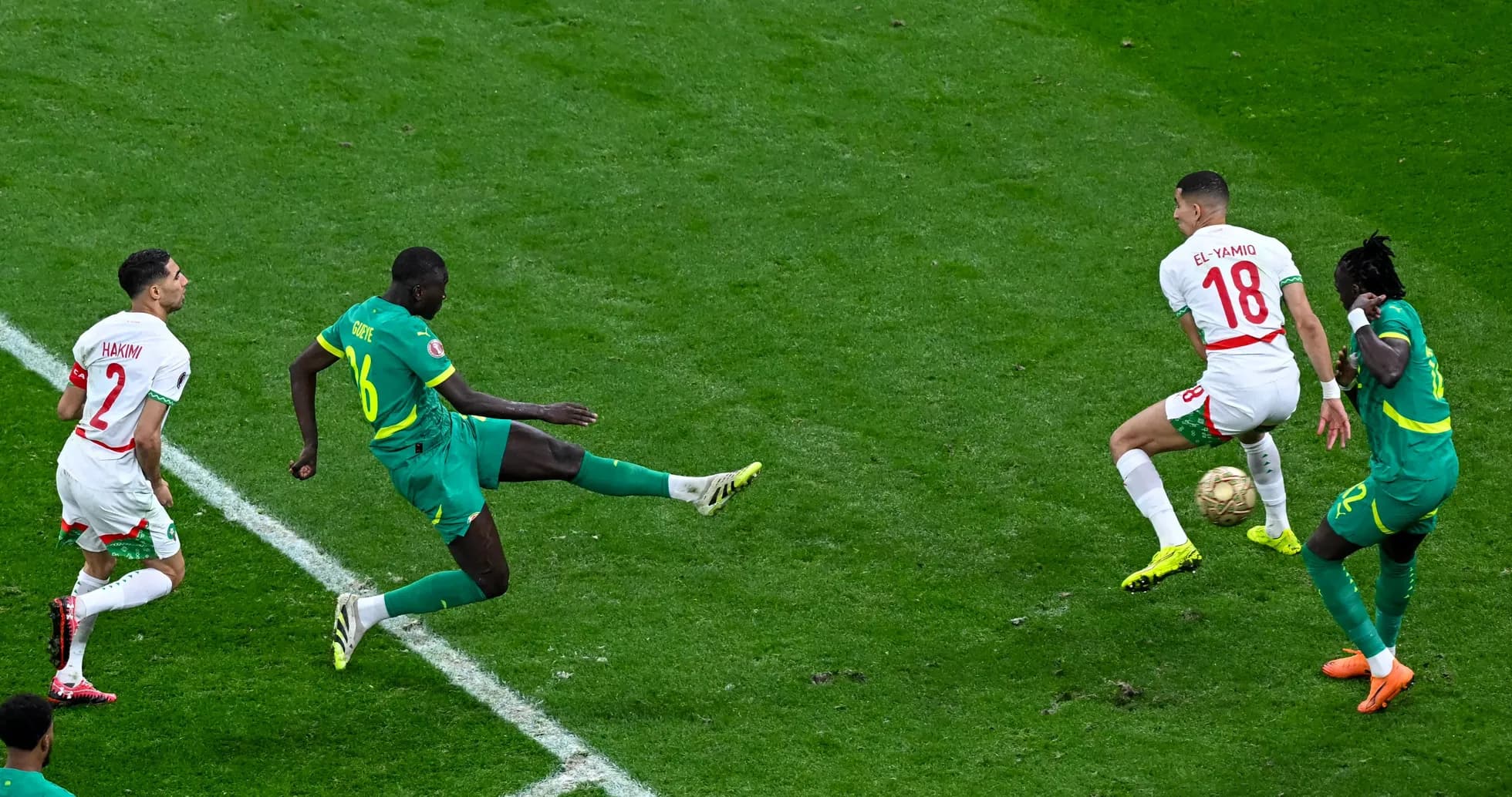 Players contesting the ball during a football match