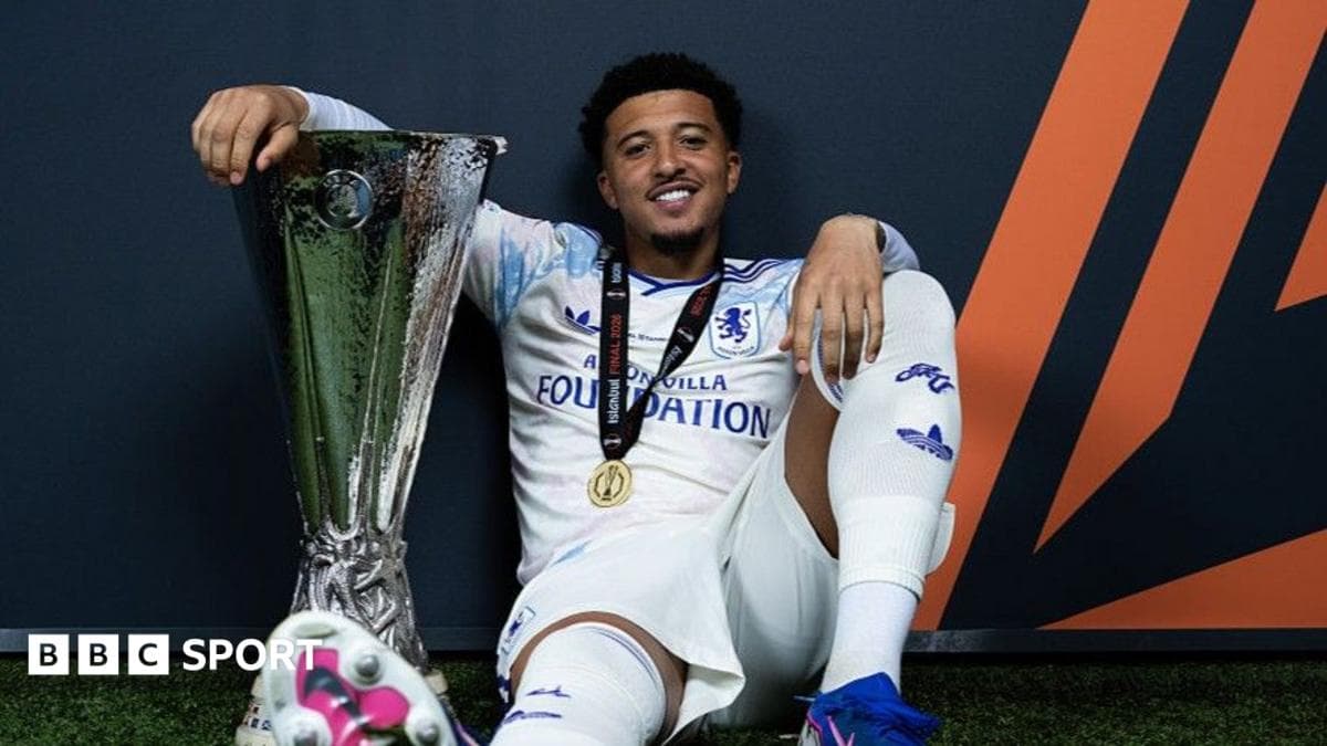 Player celebrating with trophy after winning match