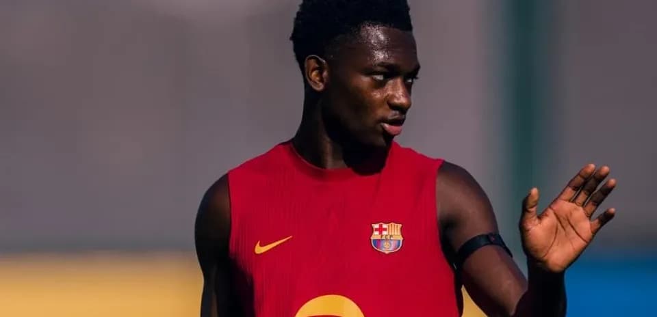 Player training in Barcelona jersey gesturing during session