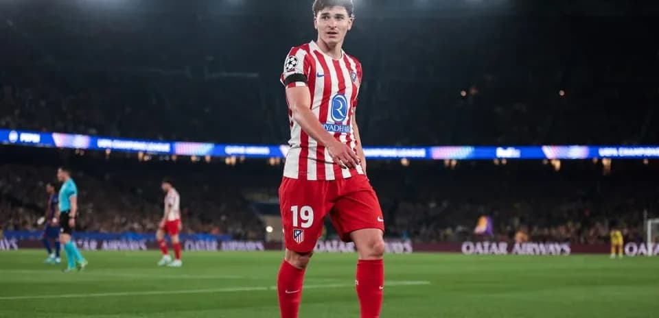 Player in Atlético Madrid kit on the pitch